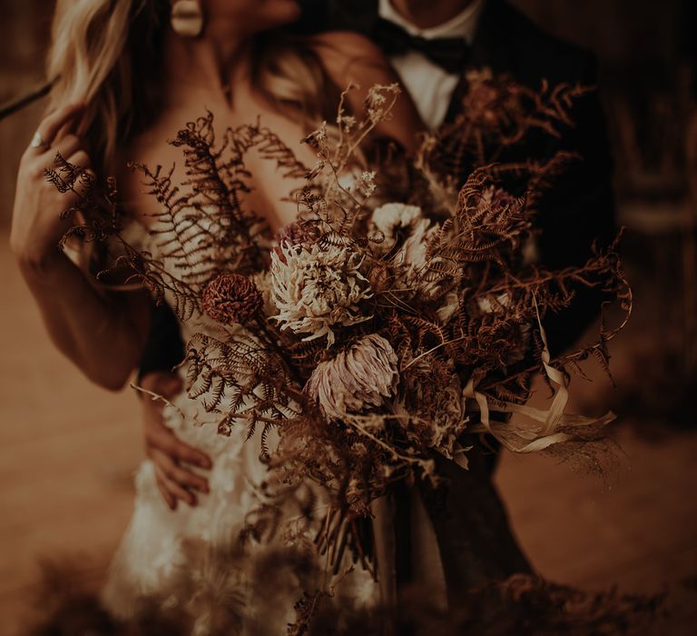 Dried flower wedding bouquet with ferns