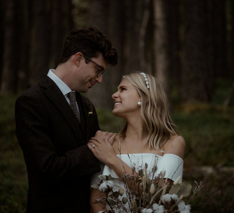 Bride & groom look lovingly at one another during elopement