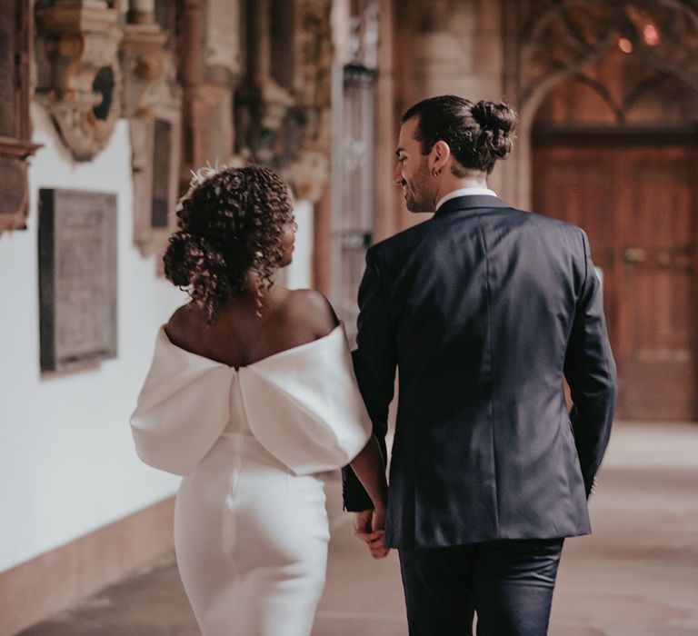 Bride & groom walk together after wedding ceremony