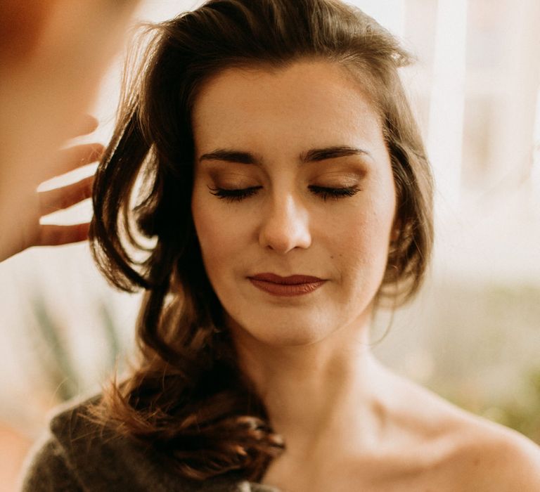 Beautiful bride with brown eyeshadow and lipstick 