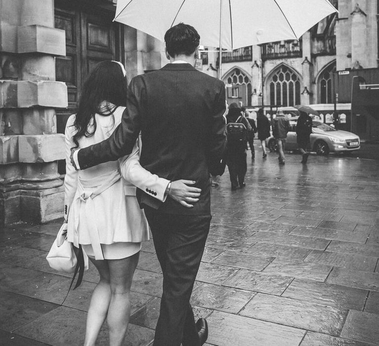 Bride and groom holding each other