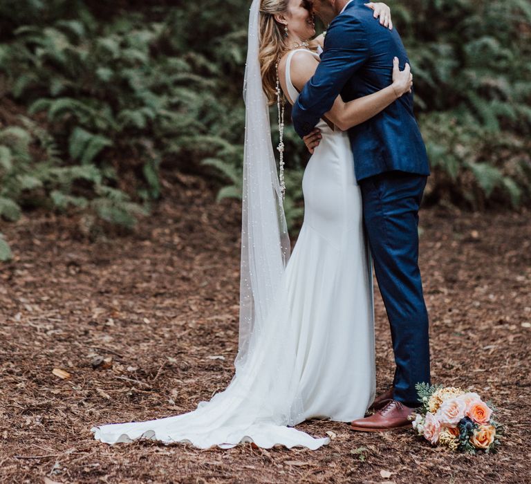 Bride & groom embrace one another after wedding ceremony during elopement 