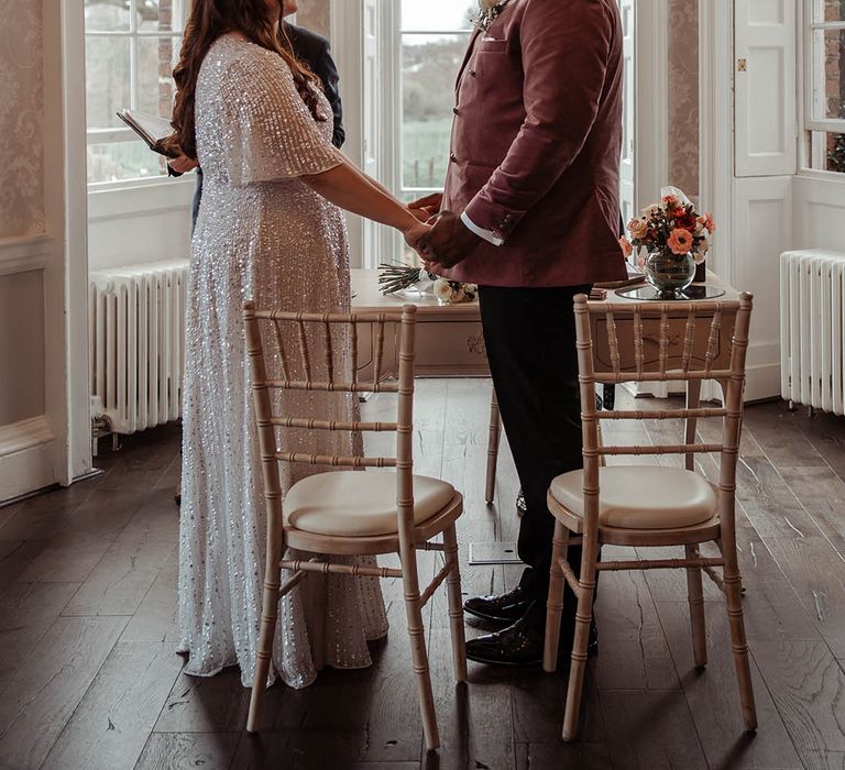 Bride & groom look lovingly at one another during ceremony 