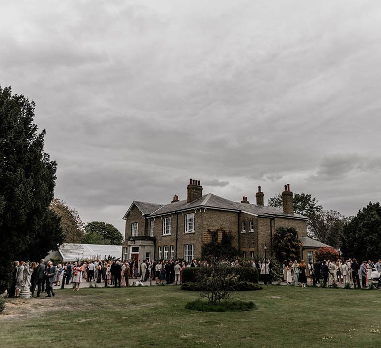 Back garden wedding with clear marquee at the bride's parent's home 