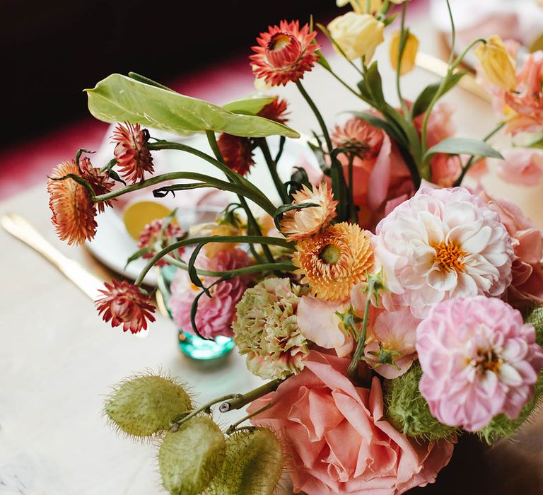 Pink dahlias, carnations, and rose spring flower centrepiece decor