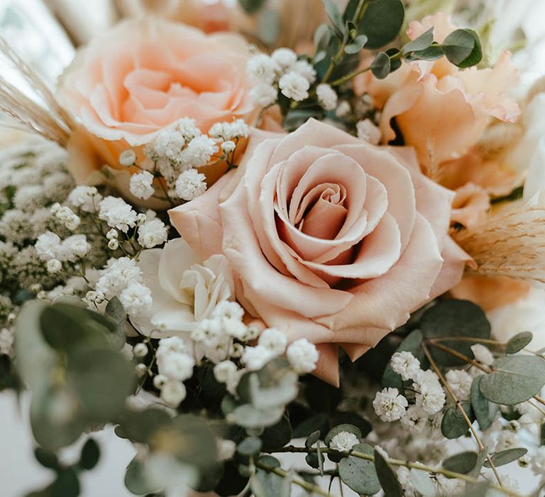 Pink roses and gypsophila in the bridal bouquet for the classic rustic luxe Elms Barn wedding 