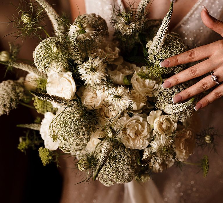 French manicured wedding nails, green and white wedding bouquet and diamond engagement ring 