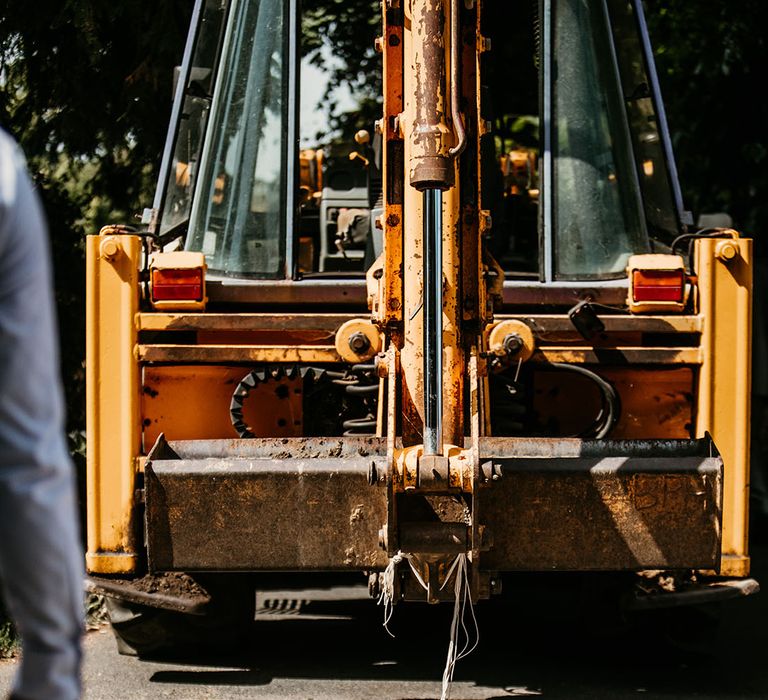 Tin cans tied to the JCB wedding transport 