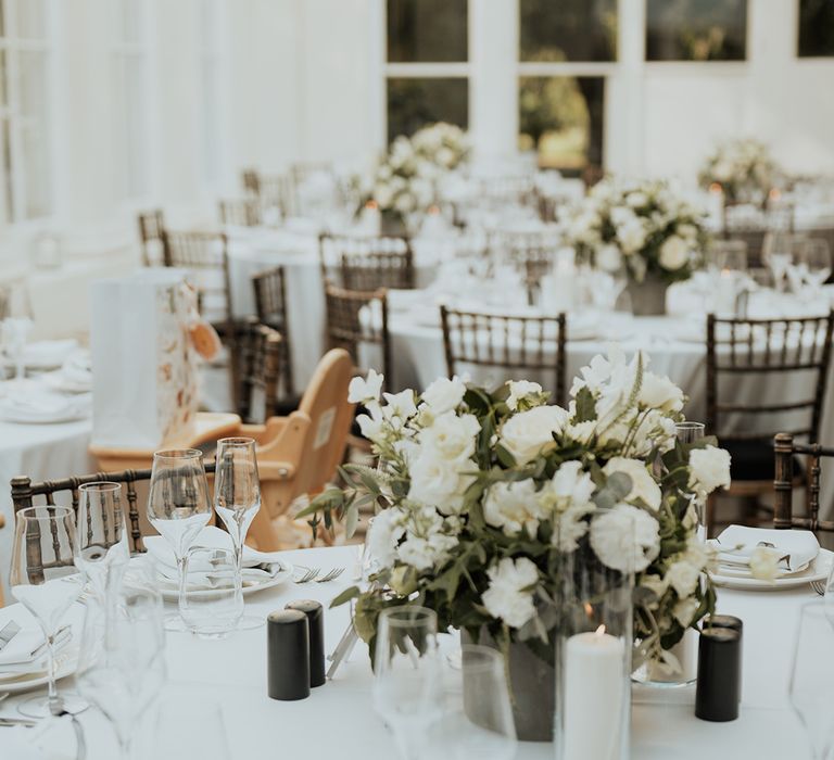 white centrepiece flowers at Gunnersbury park wedding venue 