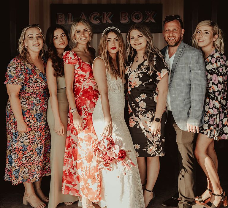 Wedding party wearing floral patterned dresses for summer wedding 