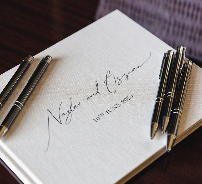 Personalised wedding guest book with pens 