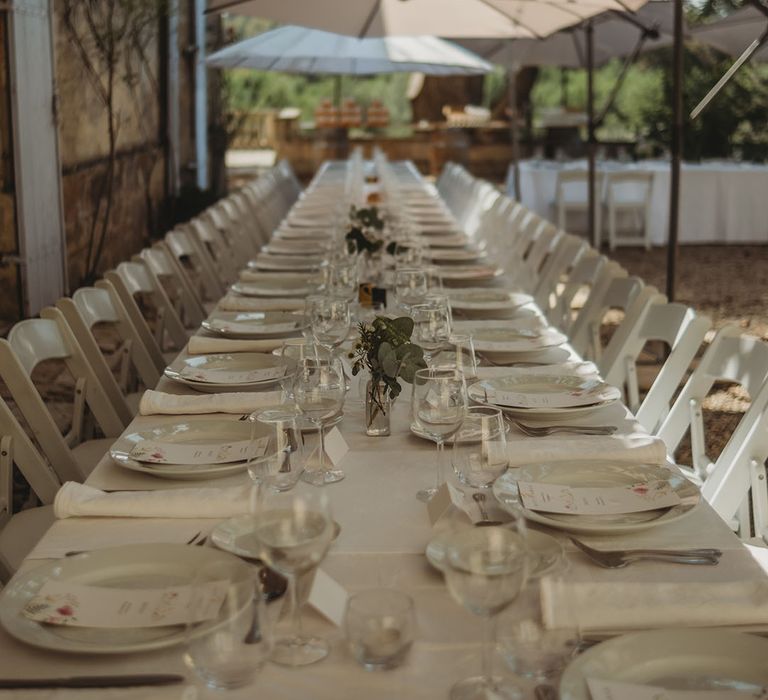 Minimalist all white wedding tablescape and decorations for outdoor al fresco wedding breakfast 