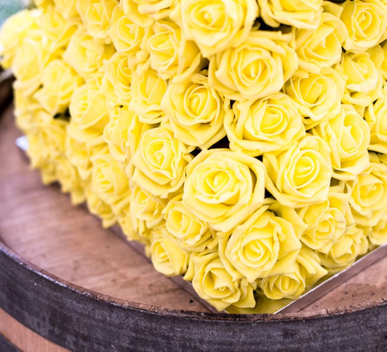 Yellow rose iced wedding cake for yellow theme wedding 