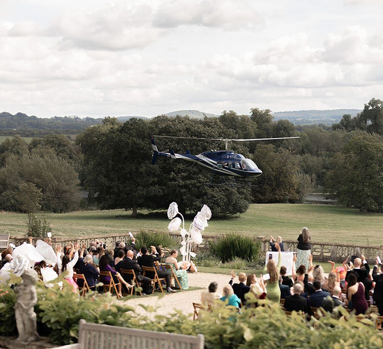 Orchardleigh Estate outdoor wedding ceremony with luxe floral arch 