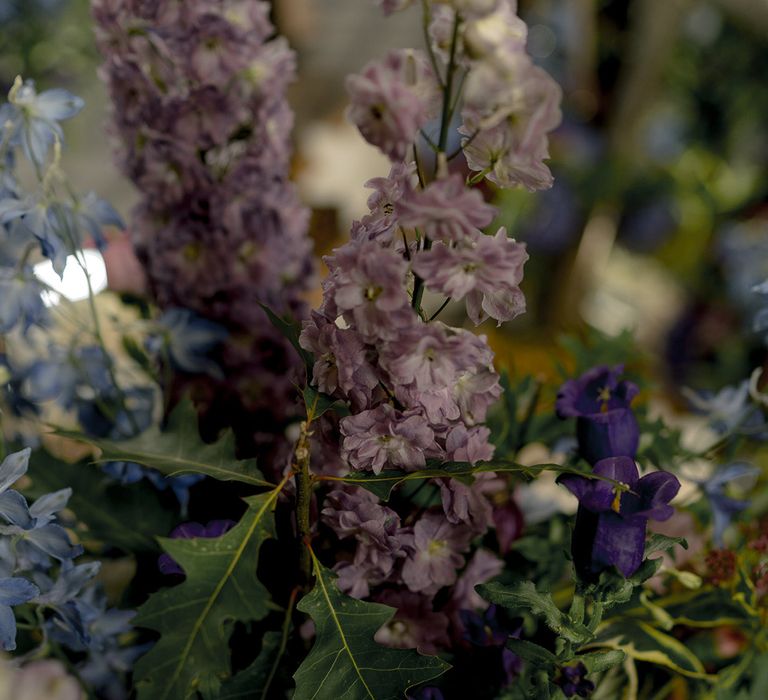 Pretty purple wedding flowers that match flowers the couple grow in their garden at home 