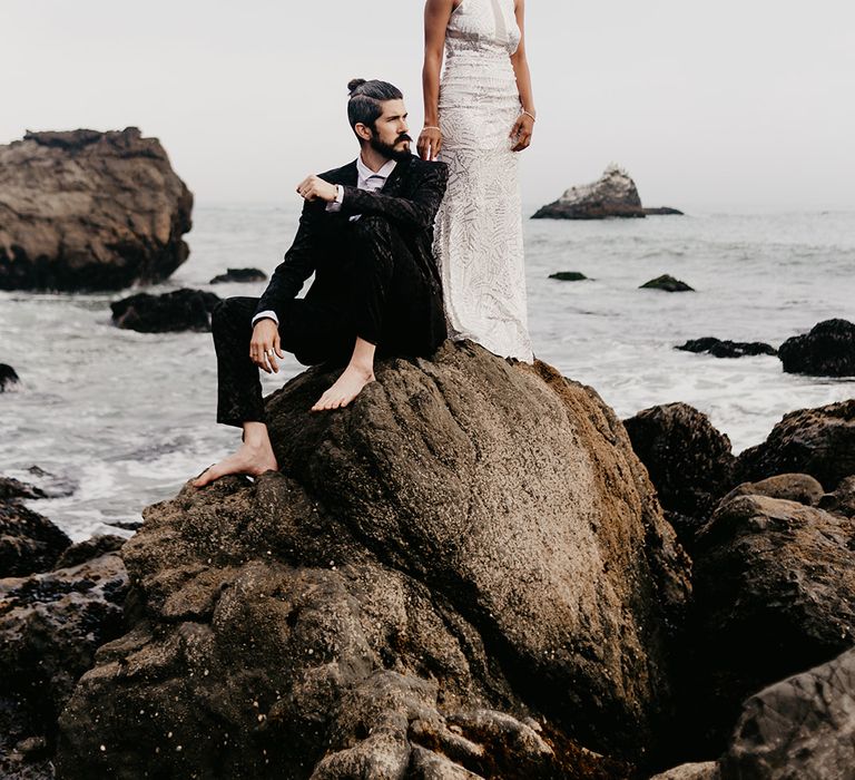 Stylish bride and groom portrait with bride in silver wedding dress 