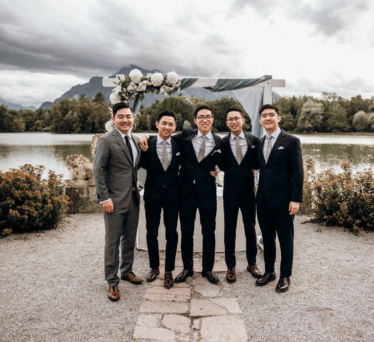 Groomsmen portrait in black and grey wedding suits 