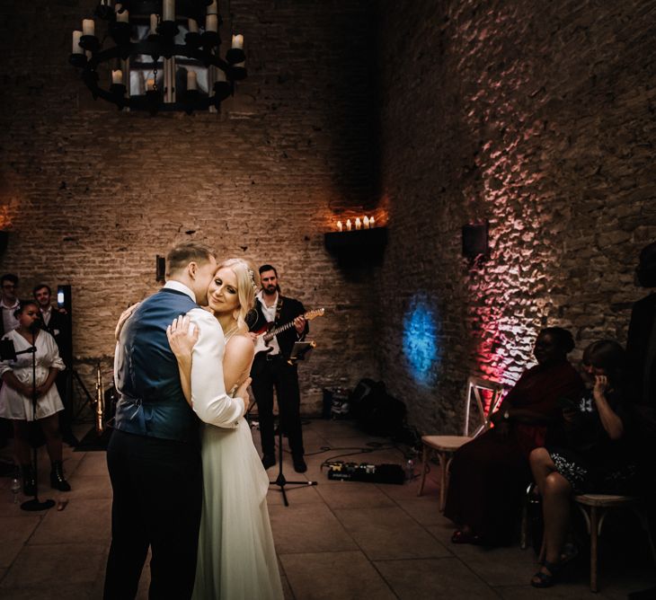 Bride and groom first dance at barn wedding