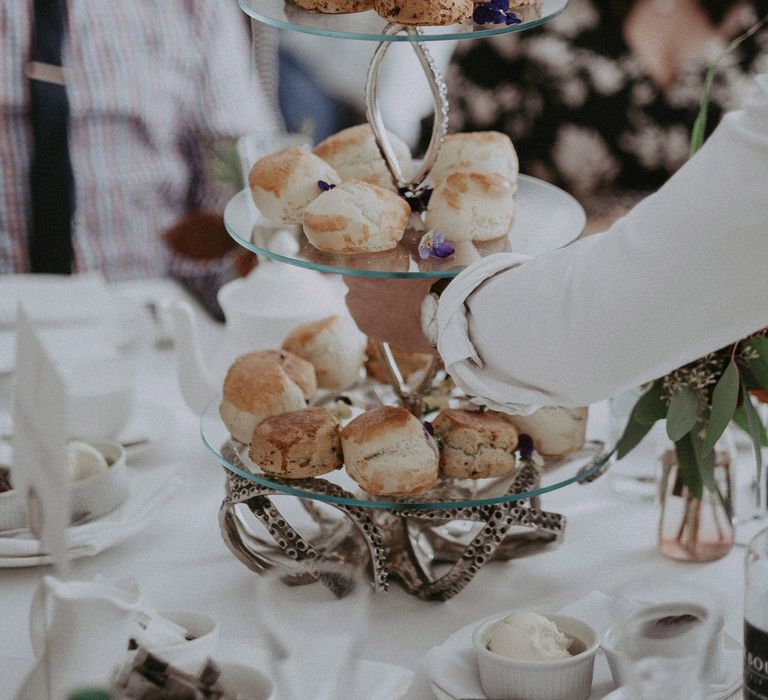 Scones on a glass cake stand for the wedding breakfast 