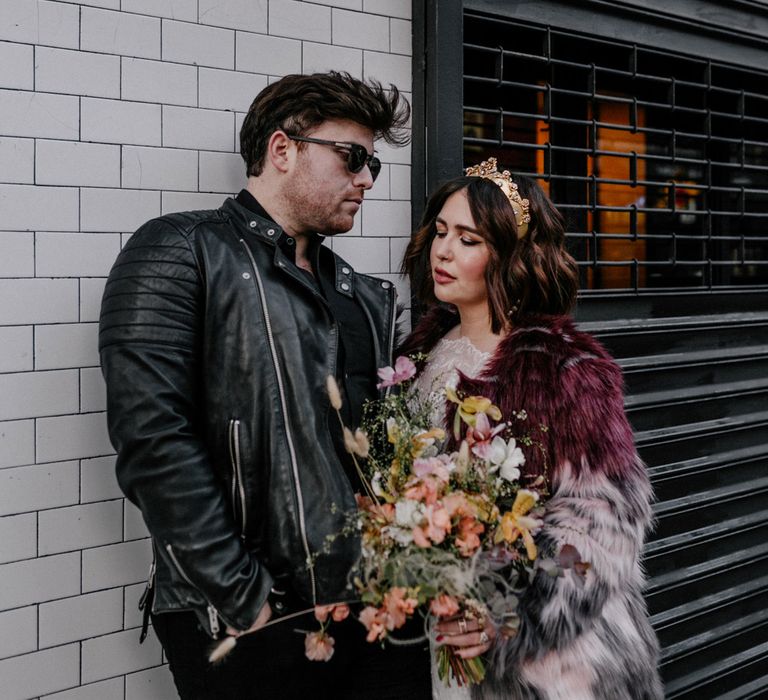 Bride holding floral bouquet on the streets of New York