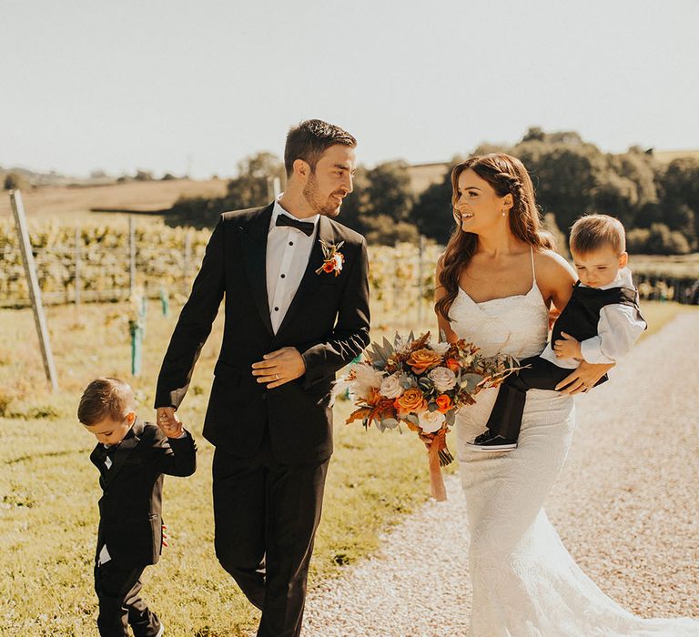 Family shot of bride and groom with their two children