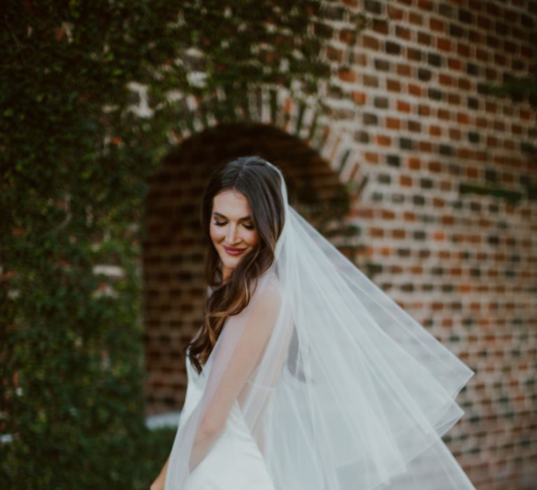 Mexico bride wears a minimal, silk bridal dress and veil