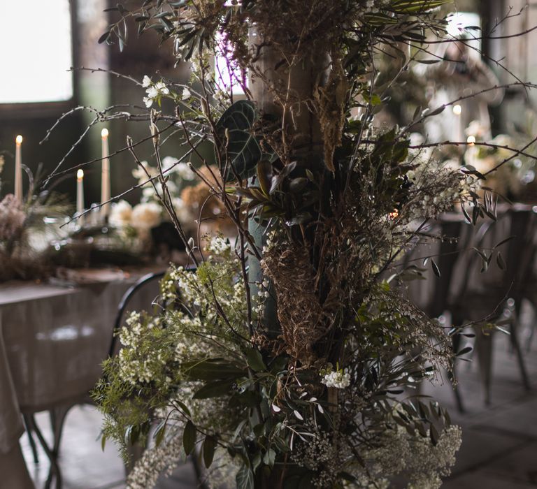 SASSFLOWER arrangements at industrial wedding venue 