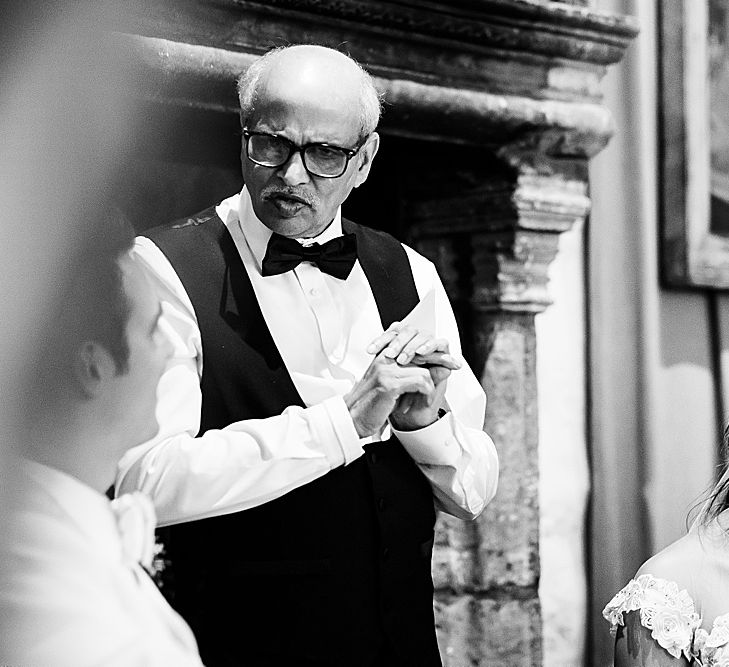 Bride in a tiara listening to her fathers wedding speech 