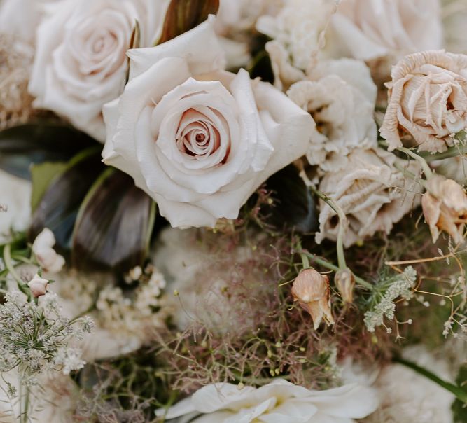 Wedding flowers with pale pink roses and grasses 