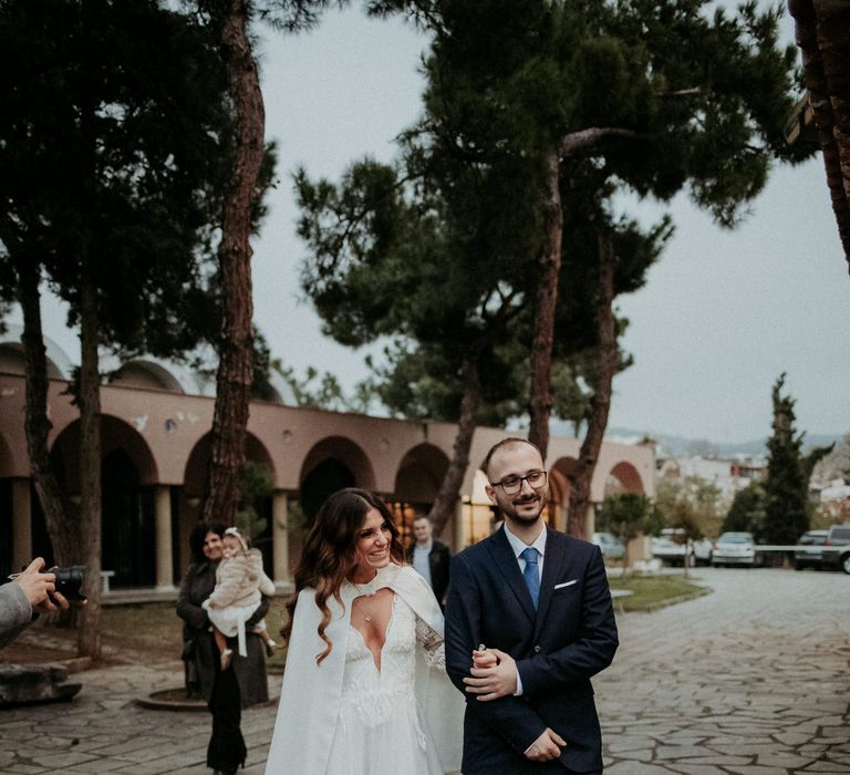 The bride being escorted to her church wedding ceremony