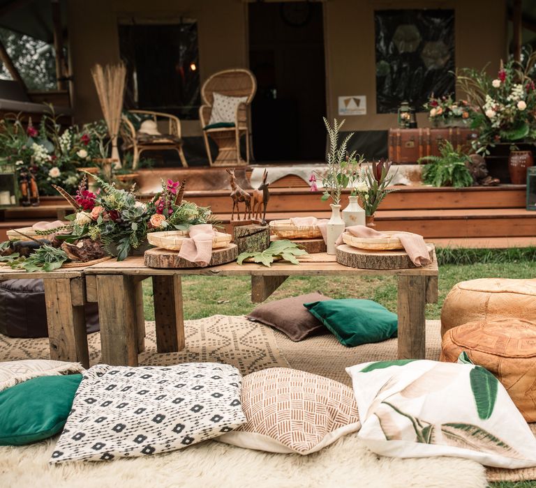 Safari inspired decor with colourful pillows and wooden table