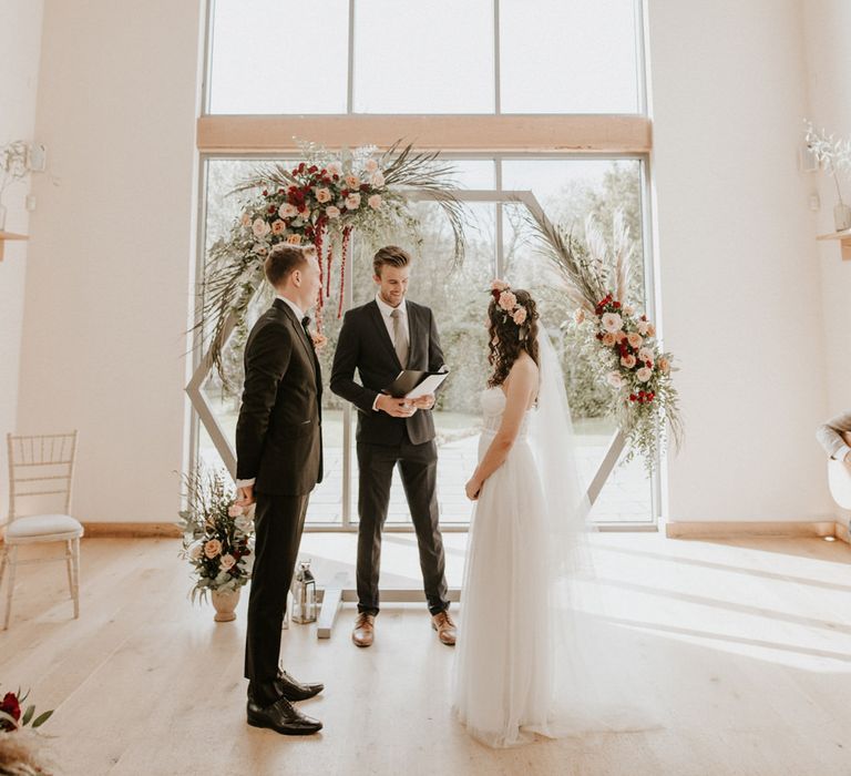 Celebrant conducting the intimate ceremony at Millbridge Court wedding venue 