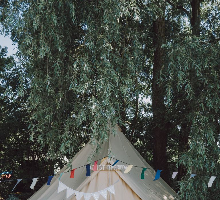 'Just Married' tent in garden with colourful bunting