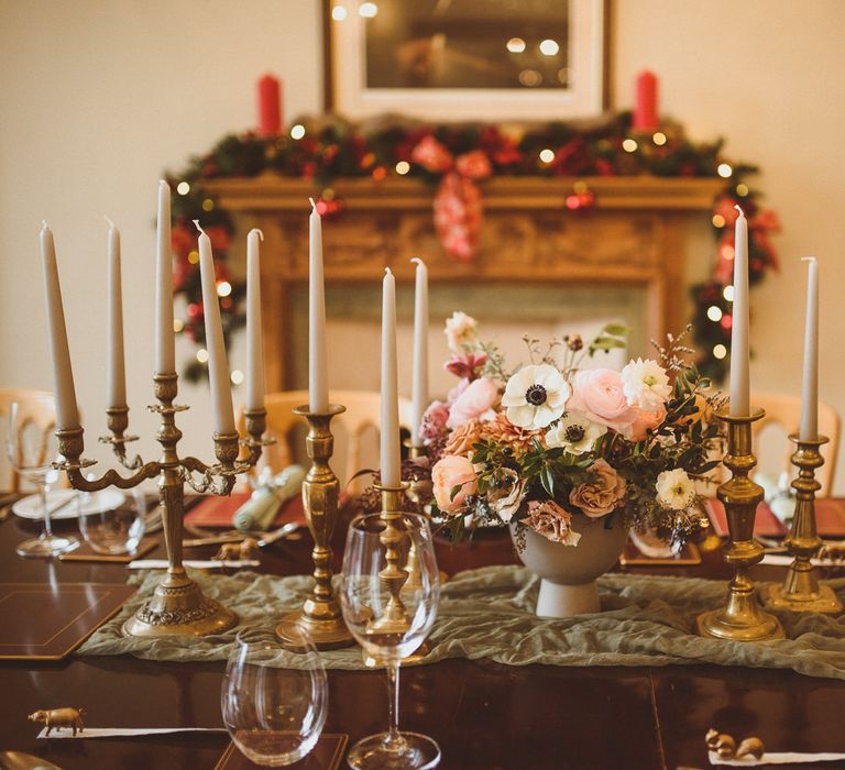 Intimate wedding table decor with floral centrepiece, candelabra and candlesticks 