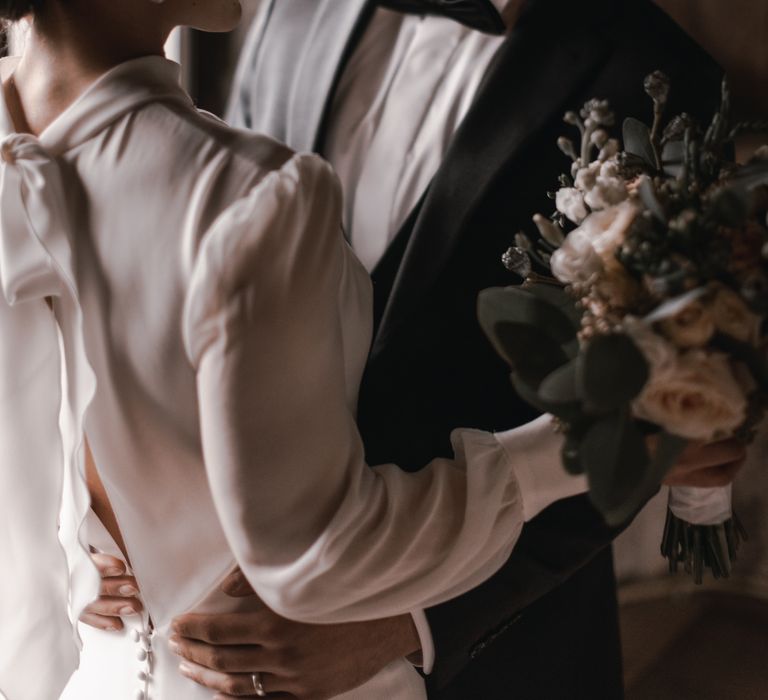 Bride & groom look lovingly at one another on their wedding day