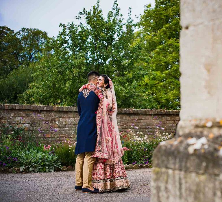 Bride and groom hug at first look