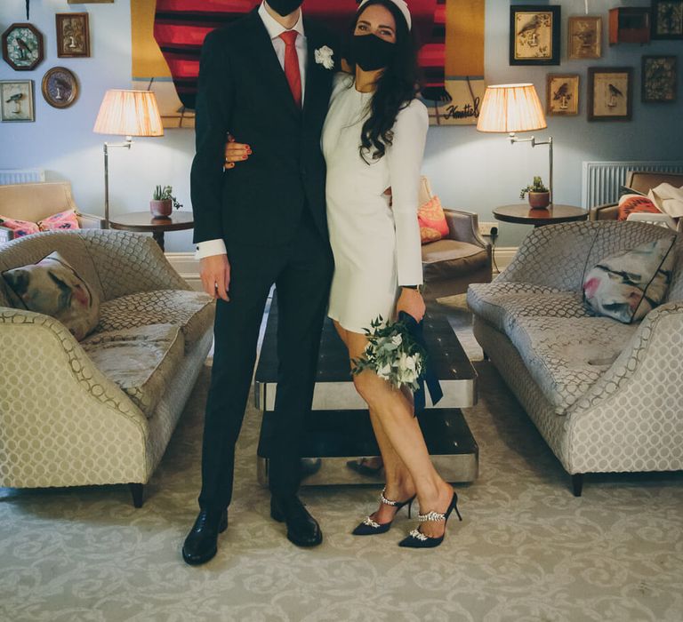 Bride and groom wearing face masks 