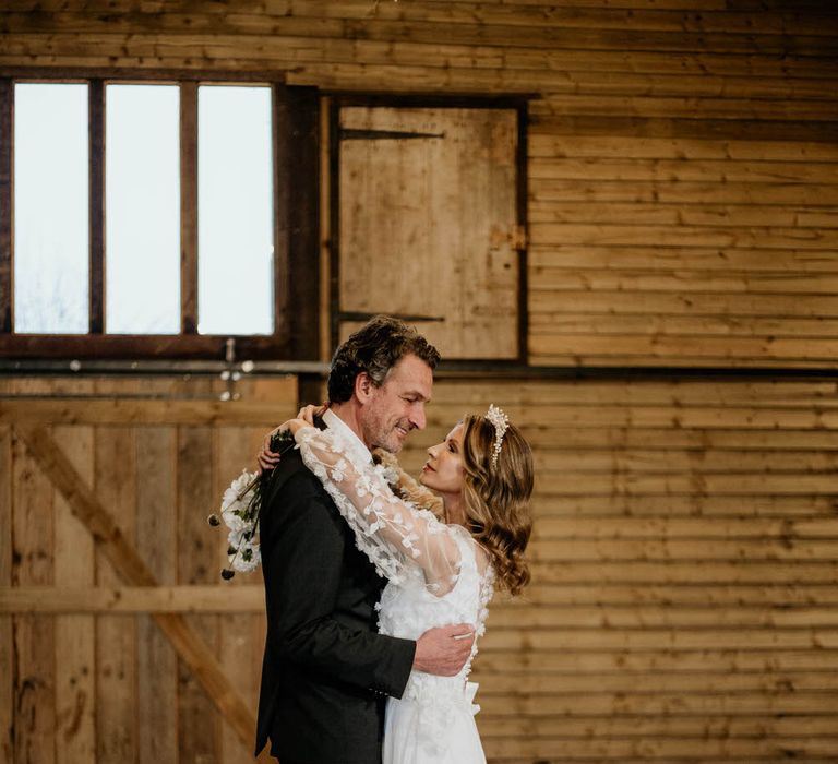 Bride and groom dancing inside the barn at High Billinghurst Farm