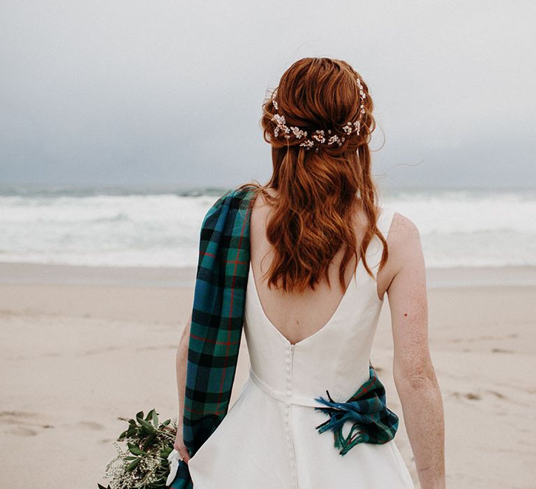 Bride with red hair with half up half down wavy wedding hairstyle 