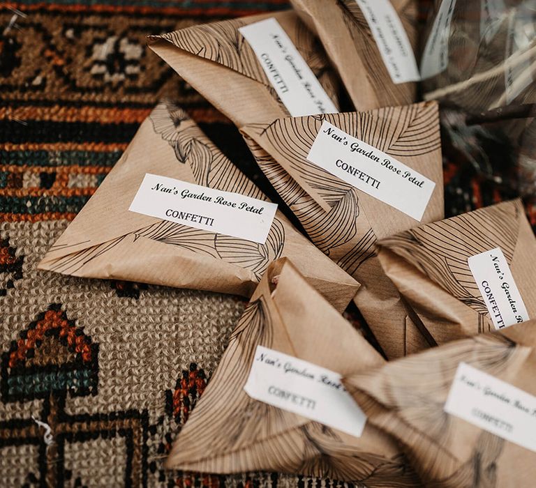 Brown paper packages filled with wedding confetti