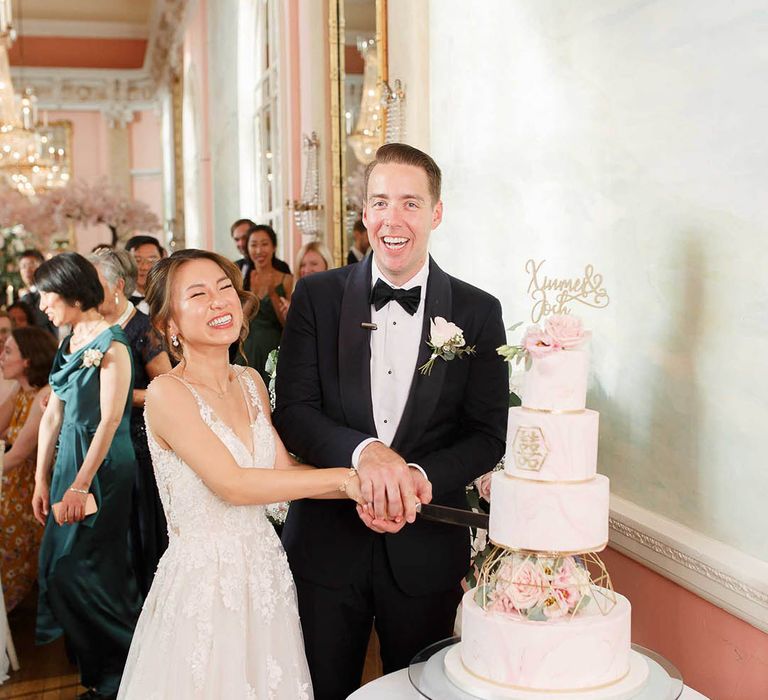 Bride & groom cut their wedding cake during reception