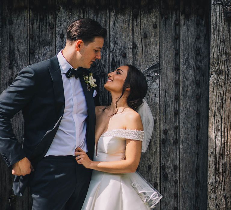 Bride and groom gaze lovingly into each other's eyes after their wedding ceremony