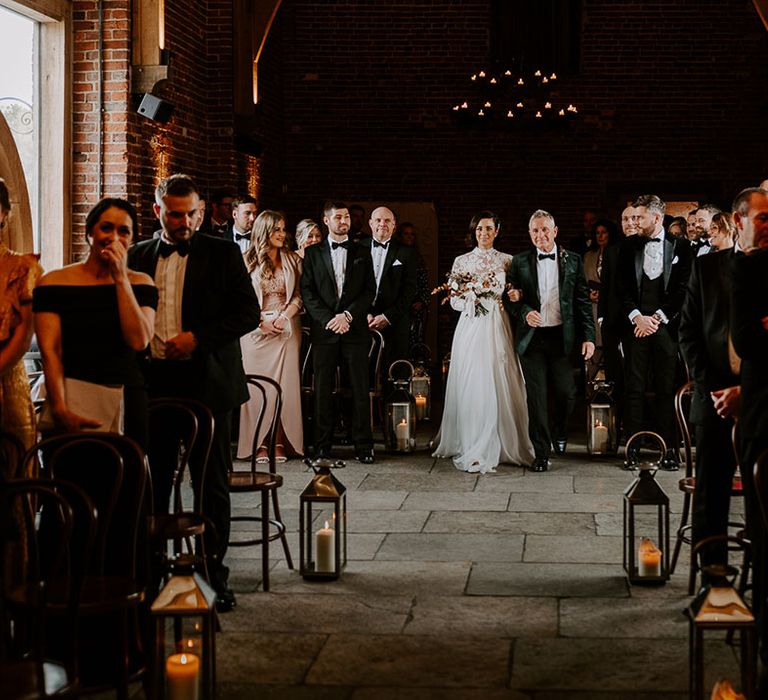 Father of the bride in black tie walks bride in lace wedding dress own the aisle at Hazel Gap Barn venue