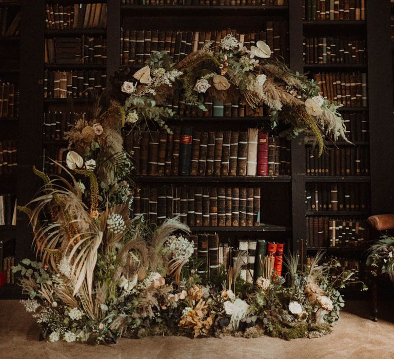 Crescent moon shape moongate with pampas grass and fresh flowers 