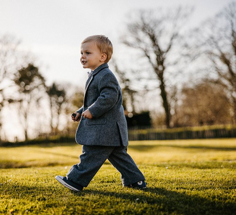 Little boy in grey su8it for the wedding at Launcells Barton