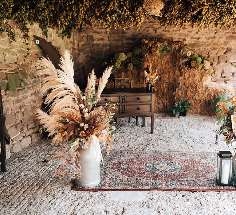 Lyde Court wedding venue complete with dried florals and Moroccan styled rug 