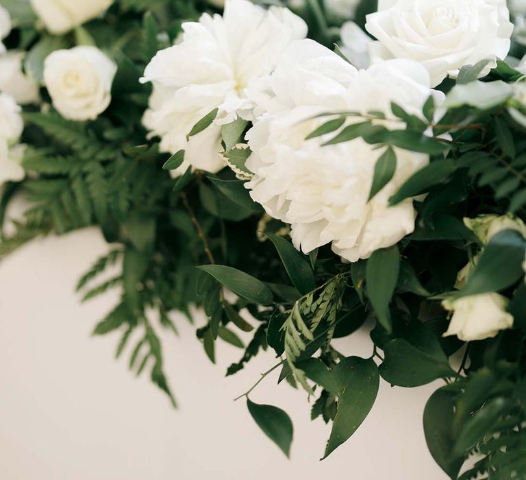 green foliage and white flower wedding arrangements 