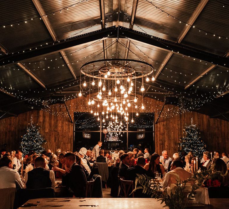 Silchester Farm wedding venue in Hampshire with big festoon lighting installation decorated for Christmas winter wedding