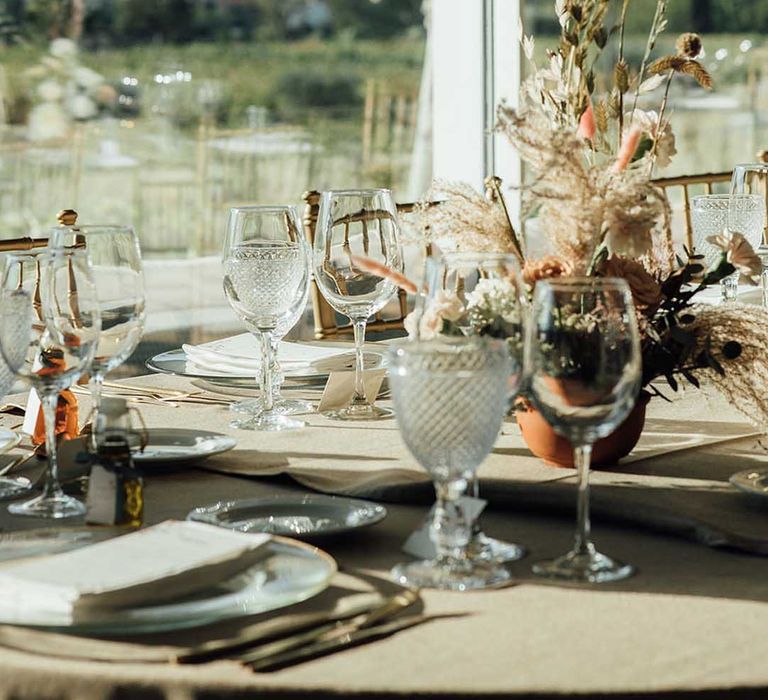 wedding table decorations with cut glassware and dried flower arrangements 