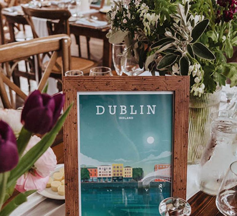 Industrial style wedding with colourful photo frame table name signs named after locations special to the bride and groom 